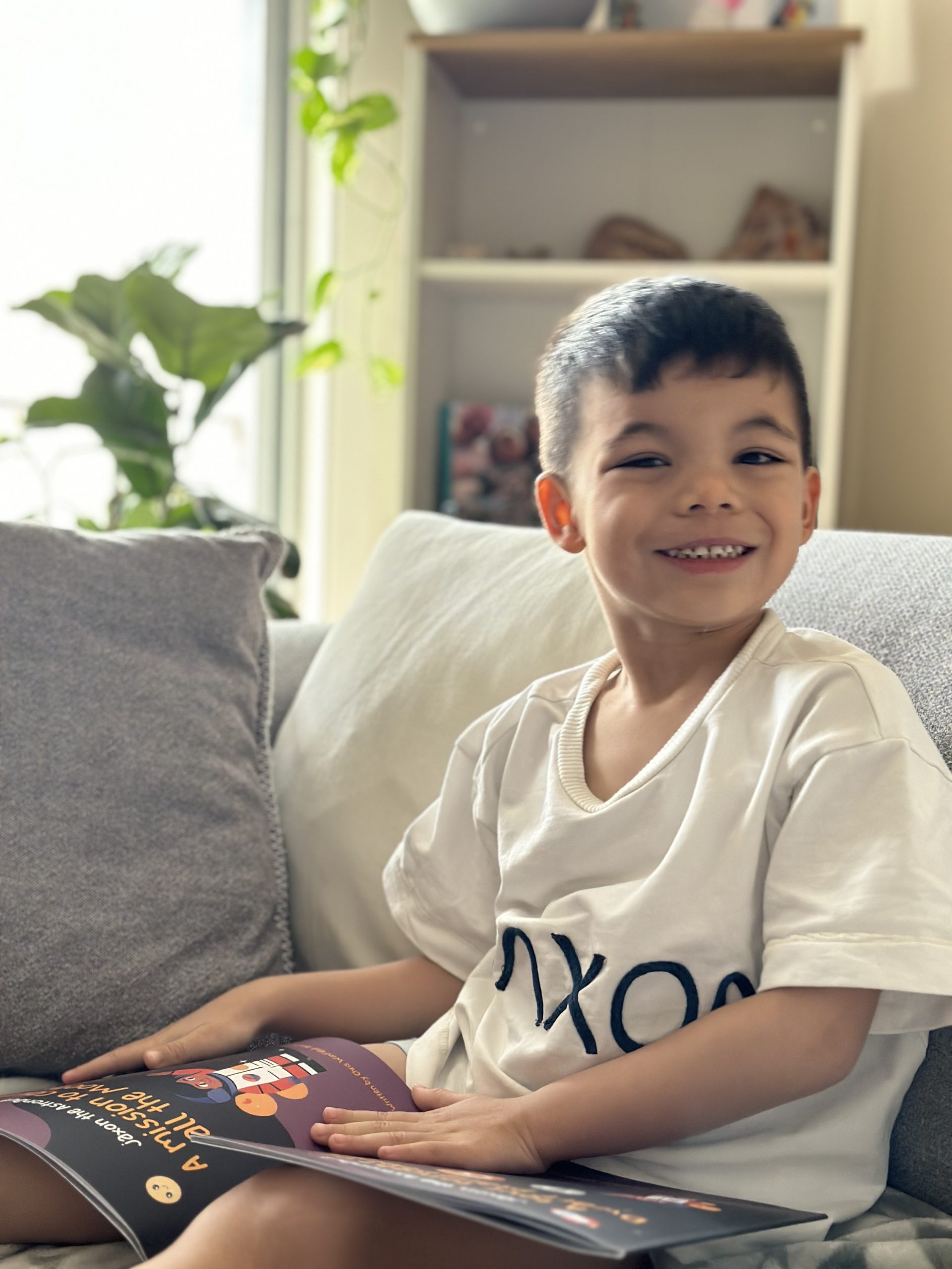 Jaxon reading his books
